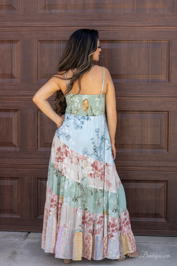 "Sage Ethnic Floral Sweetheart Maxi Dress from Timeless Threads Boutique featuring a vibrant ethnic floral print and a romantic sweetheart neckline, perfect for adding boho-chic elegance to any occasion."