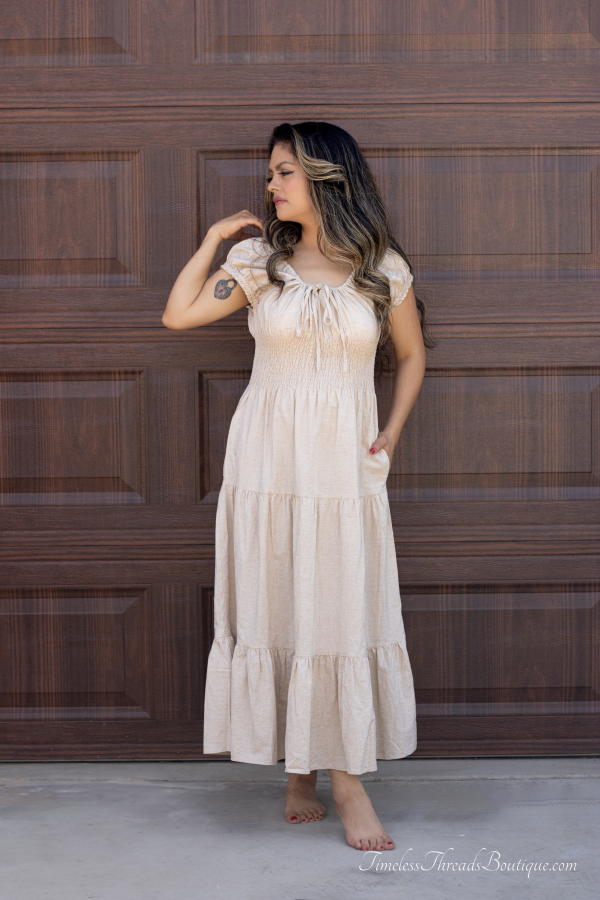 "Serena Cotton Linen Soft Washed Maxi Dress with a tie front that scrunches the bust area, pockets, and versatile off-shoulder design, offering a chic and comfortable look."