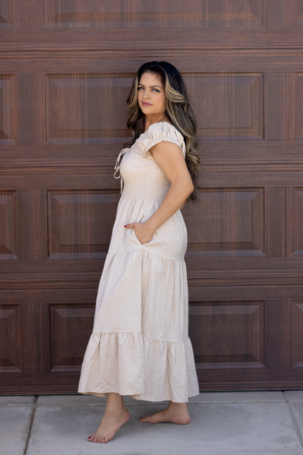 "Serena Cotton Linen Soft Washed Maxi Dress with a tie front that scrunches the bust area, pockets, and versatile off-shoulder design, offering a chic and comfortable look."