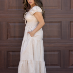 "Serena Cotton Linen Soft Washed Maxi Dress with a tie front that scrunches the bust area, pockets, and versatile off-shoulder design, offering a chic and comfortable look."