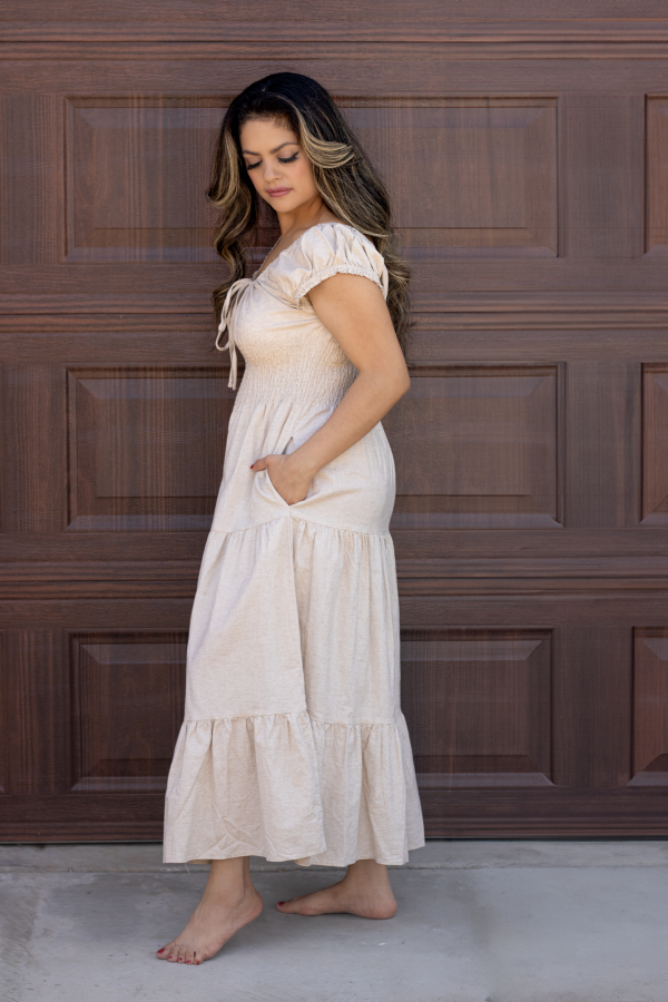 "Serena Cotton Linen Soft Washed Maxi Dress with a tie front that scrunches the bust area, pockets, and versatile off-shoulder design, offering a chic and comfortable look."