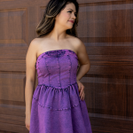 "Emily's Effortless Elegance Stretch Denim Short Dress in a purple-washed hue, featuring a comfortable stretch denim fabric and a stylish, flattering fit for versatile casual elegance."