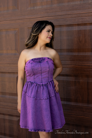 "Emily's Effortless Elegance Stretch Denim Short Dress in a purple-washed hue, featuring a comfortable stretch denim fabric and a stylish, flattering fit for versatile casual elegance."