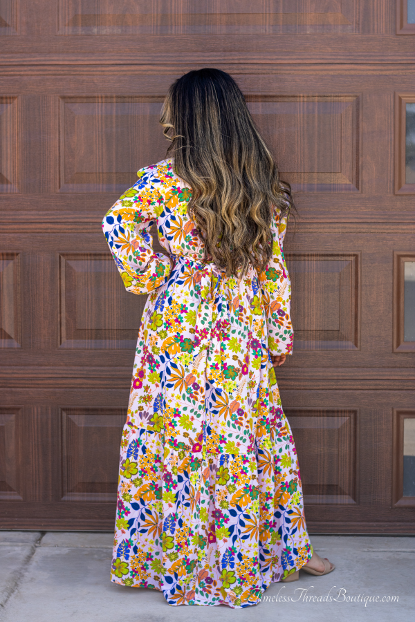 "Chic Elegance Multi-Floral Satin Maxi Pink Dress from Timeless Threads Boutique featuring a vibrant pink satin fabric with a captivating multi-floral print, offering a luxurious and sophisticated look."