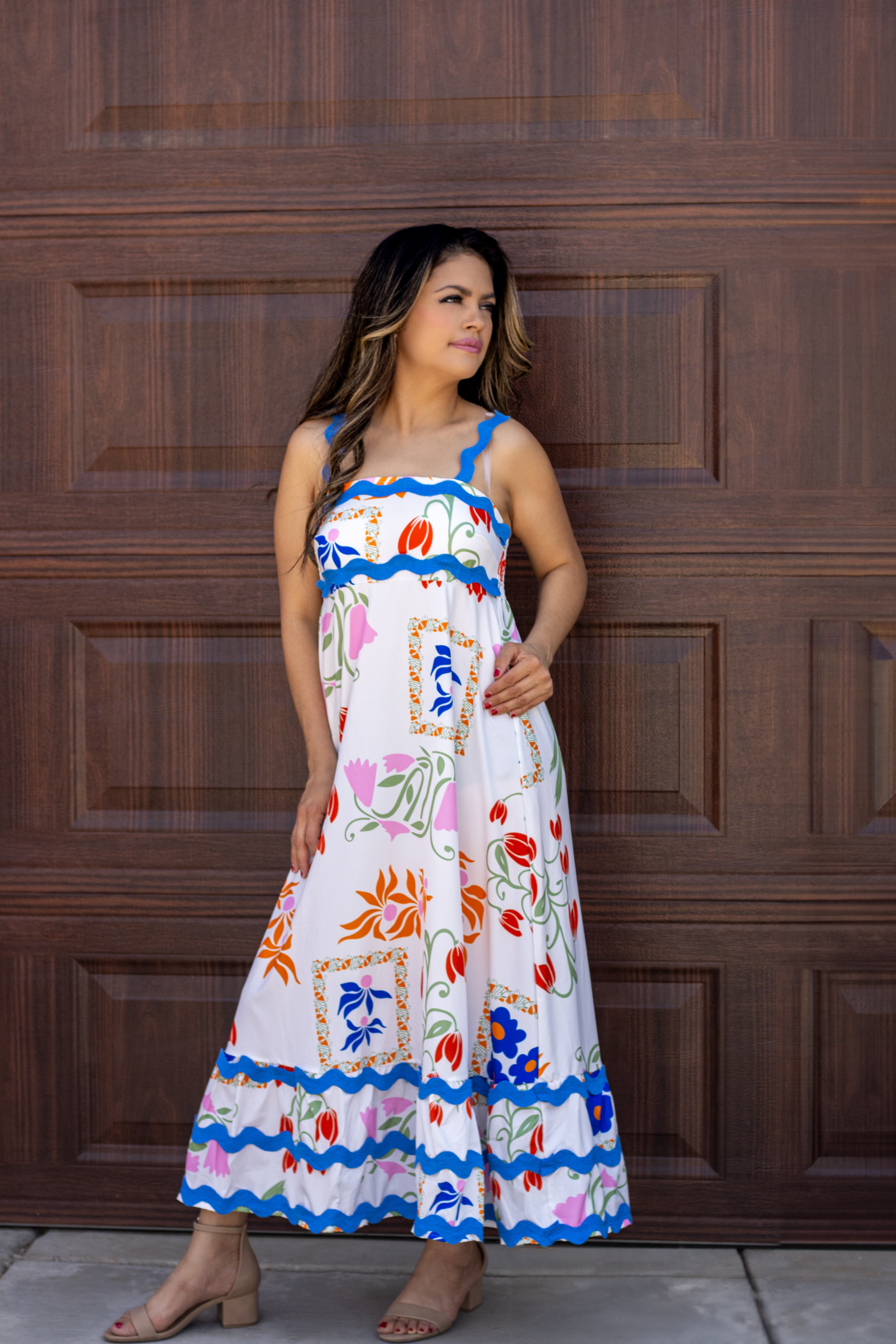 Elara White Floral Wave Strap A-Line Dress "Elara White Floral Wave Strap A-Line Dress featuring delicate floral patterns and an elegant A-line silhouette, perfect for versatile styling."