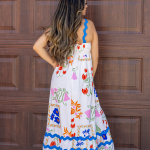 "Elara White Floral Wave Strap A-Line Dress featuring delicate floral patterns and an elegant A-line silhouette, perfect for versatile styling."