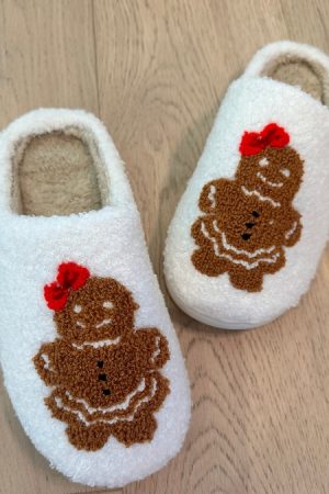 Gingerbread Girl Slippers White featuring a cute gingerbread girl applique with a red bow, offering cozy comfort and festive charm for the holiday season.