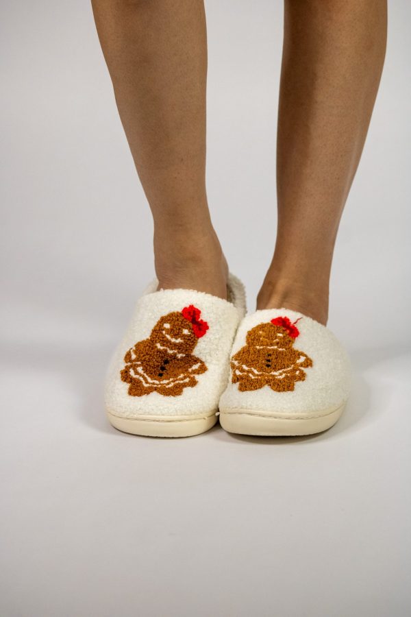 *Gingerbread Girl Slippers White* featuring a cute gingerbread girl applique with a red bow, offering cozy comfort and festive charm for the holiday season.