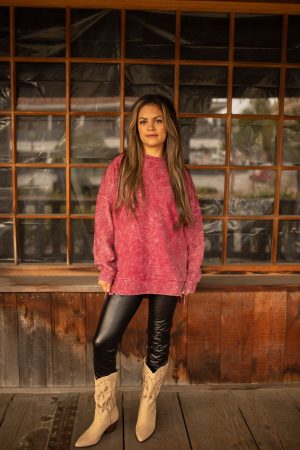 Maroon vintage-washed corded pullover with ribbed texture, crew neckline, and hi-lo hem with side slits displayed in natural outdoor lighting.