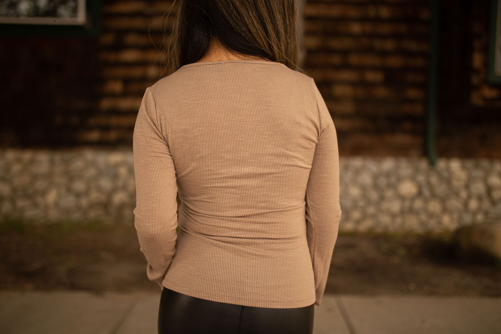 Taupe ribbed long sleeve top with lace trim and front buttons, displayed outdoors in natural lighting.